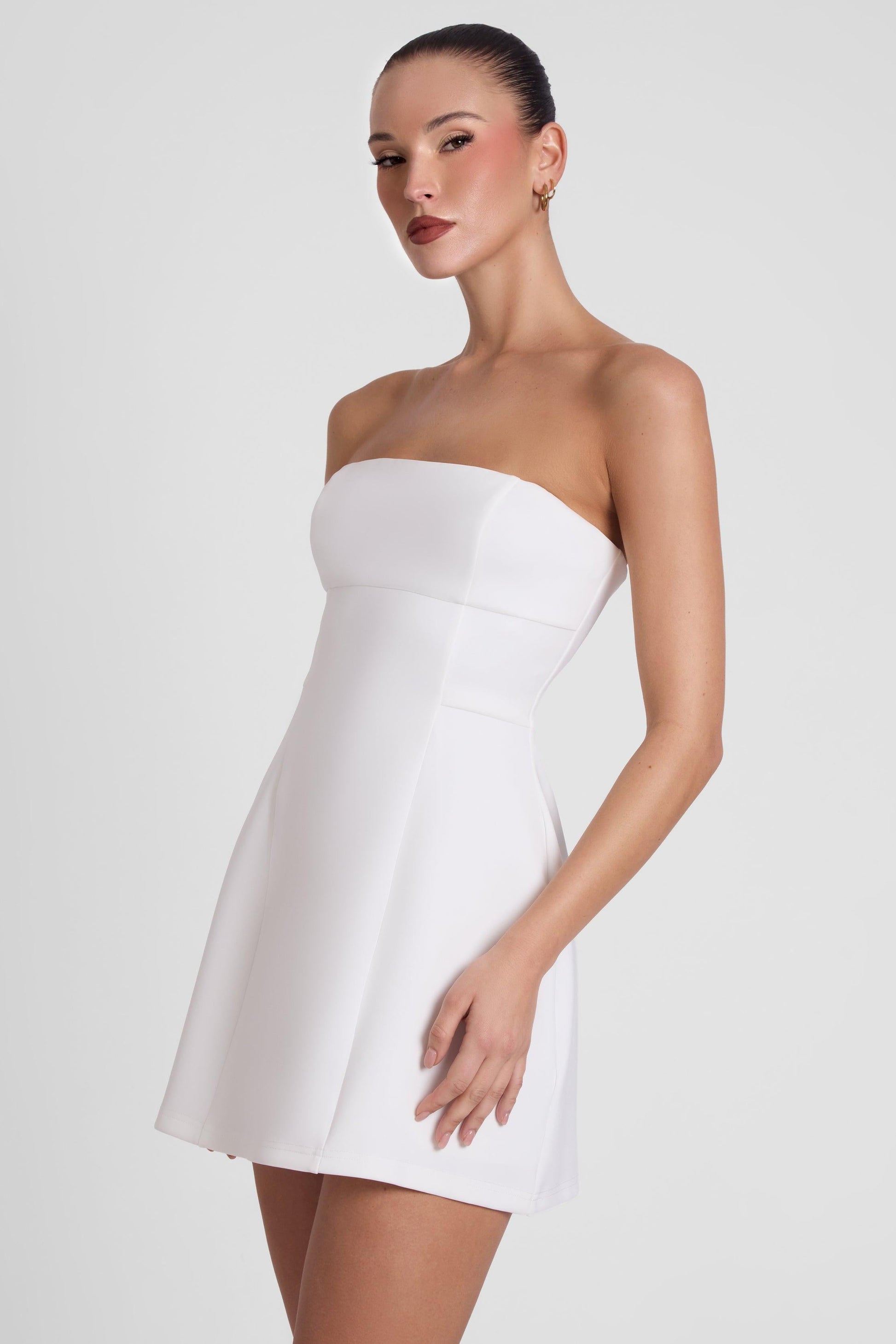Eres Collection | White Mini Dress with Fitted Bodice & Unique Seam Detail | Elegant Design for Effortless Style 1